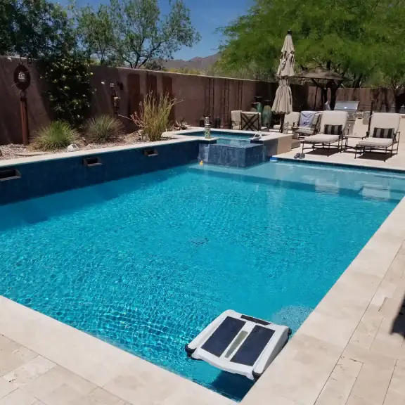 Rectangular pool and spa with robotic cleaner