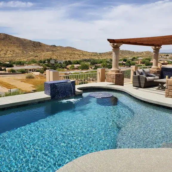 Pool with pergola and desert mountain view