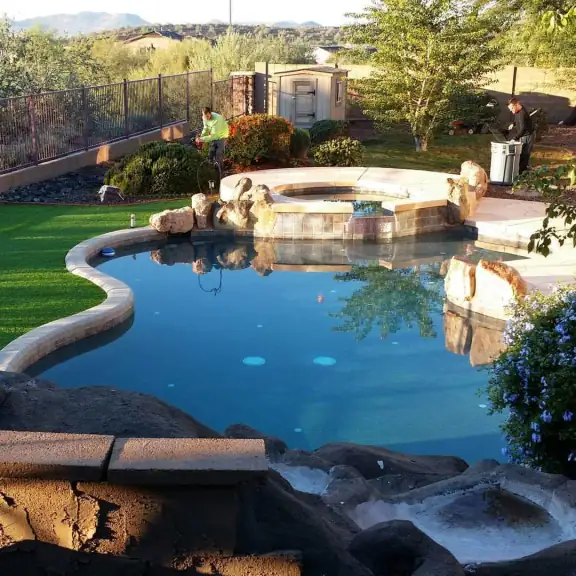 Lagoon pool and spa next to turf (square)
